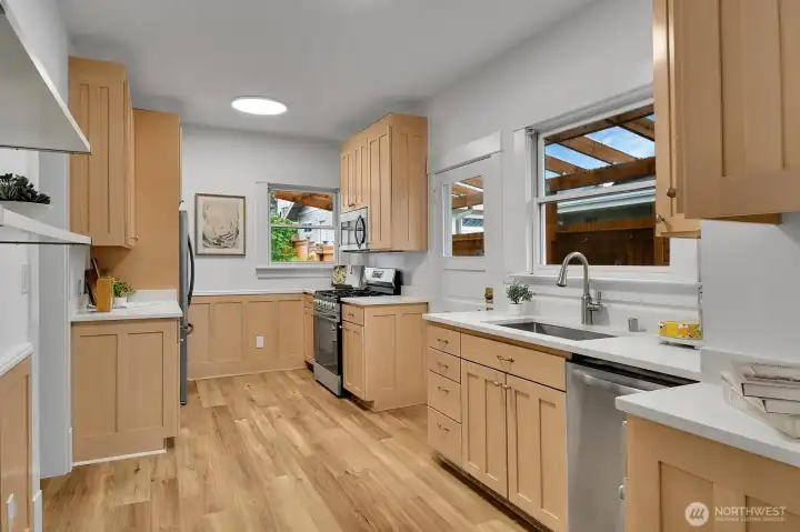 Updated kitchen with slab quartz countertops and all new stainless appliances...