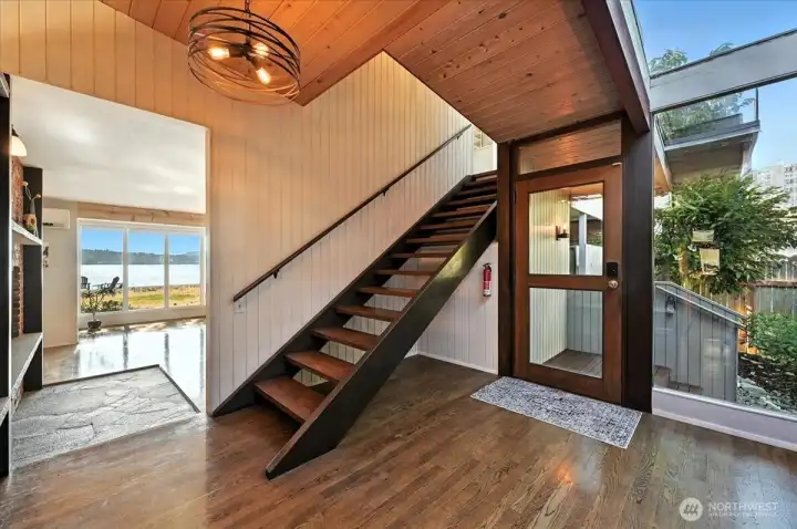Entry with skylights and hardwood floors.