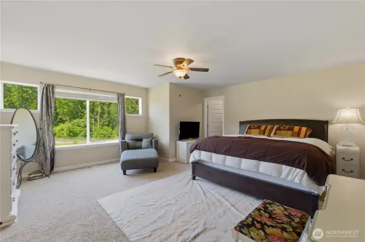 Primary bedroom with so much natural light! Plenty of room for anything you want.