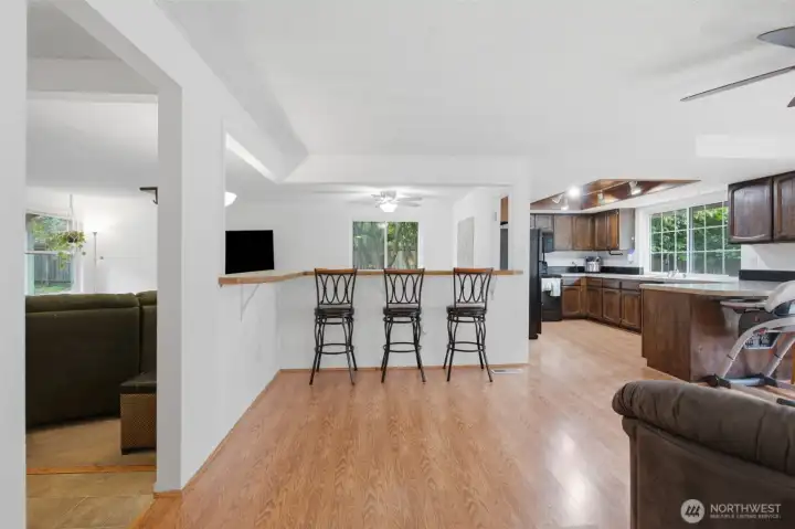 The open bar area between the kitchen, family room and living room. The open bar area between the kitchen, family room and living room.