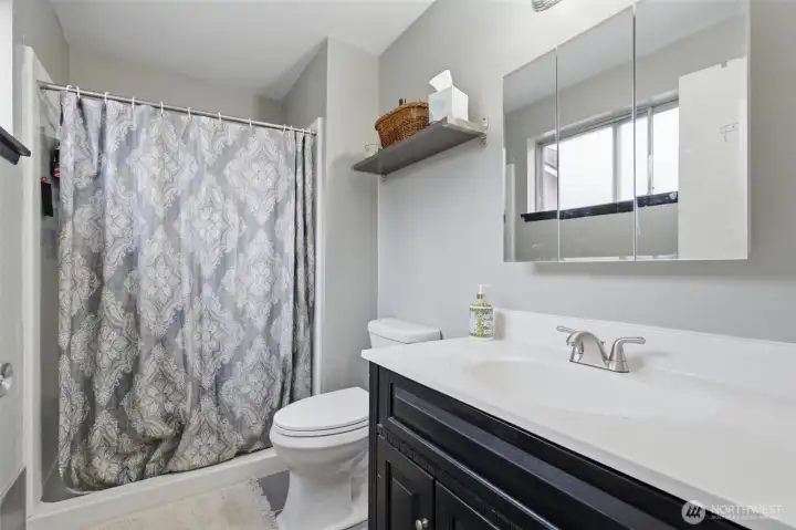 Attached primary bathroom. Attached primary bathroom.