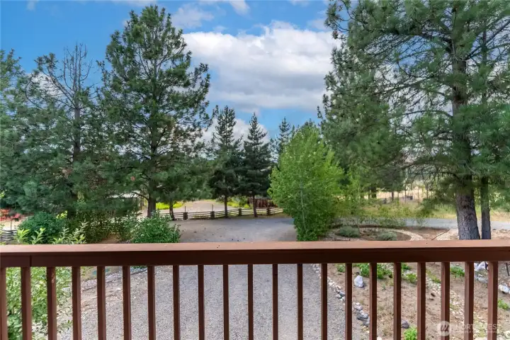 View from the covered deck overlooking mature landscaping and peaceful country setting. View from the covered deck overlooking mature landscaping and peaceful country setting.