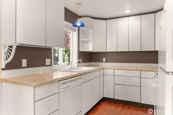 Functional kitchen with abundant cabinetry and workspace. Functional kitchen with abundant cabinetry and workspace.