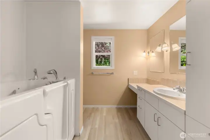 Primary bath with walk-in soaking tub for accessibility and comfort. Primary bath with walk-in soaking tub for accessibility and comfort.
