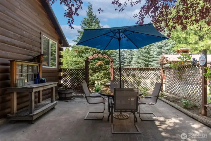 Private backyard patio surrounded by mature shade trees. Private backyard patio surrounded by mature shade trees.