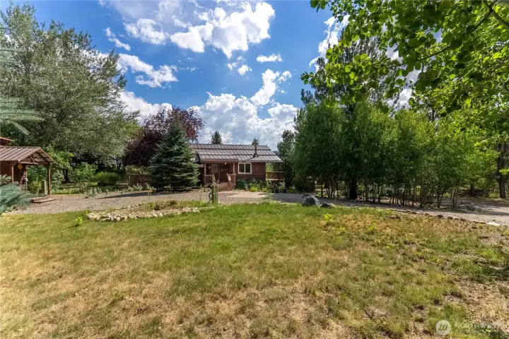 Ample driveway with RV parking and hookups for visiting family and friends. Ample driveway with RV parking and hookups for visiting family and friends.