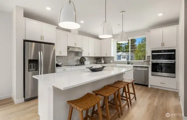 Stairs lead to spacious kitchen