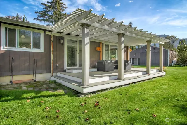 Back porch with covered space for outdoor seating! This gives you the ability to bring your indoor living outside to enjoy the natural beauty of the valley.