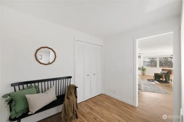 View from main level entry, living room ahead, laundry room to the right.