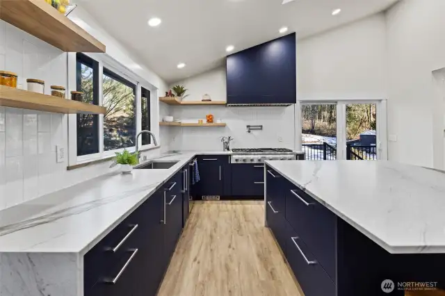 Decorative shelving, tile backsplash, plenty of storage space