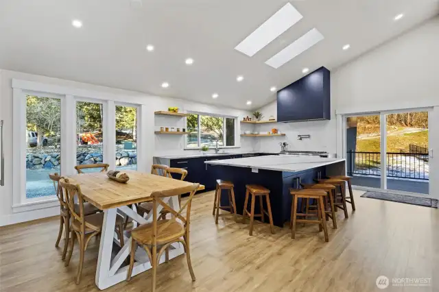 And this amazing kitchen space with room for all. Power-venting Velux skylight!