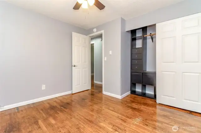 Main primary bedroom with built in closet unit!