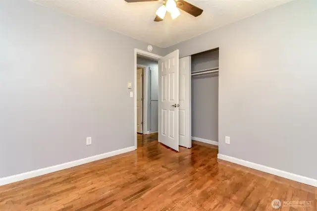 The second bedroom is located across the hallway from the primary bedroom.