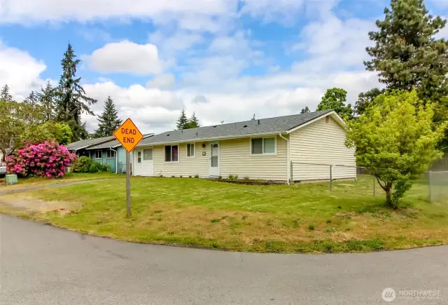 Corner lot, fully fenced in the back.  Separate drive in entrance on the side.