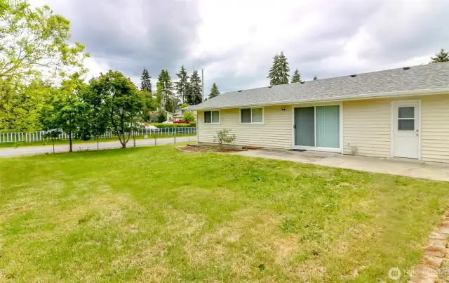 Beautiful back yard, with sliding glass door to the living room and separate entrance to that 4th bedroom on the other side of the house!