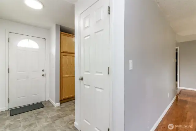 Front door leads to the kitchen, and off to the 3 bedrooms on one side of the home!