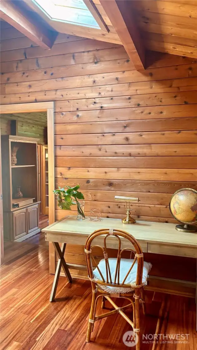 Office with vaulted ceilings and skylights