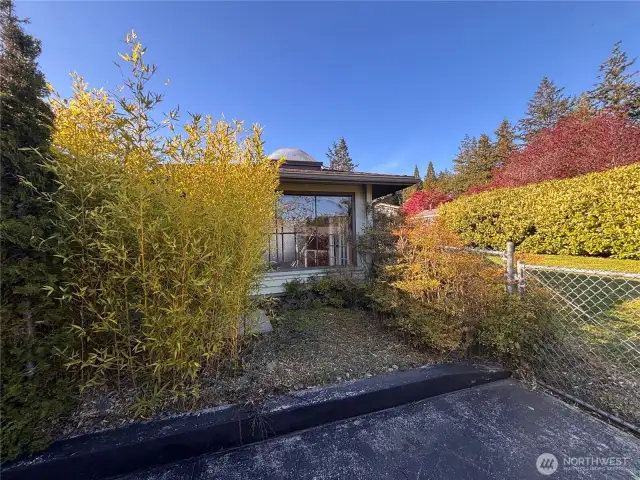 Sunroom, could be greenhouse, or spa room, entrance is from fenced in backyard.