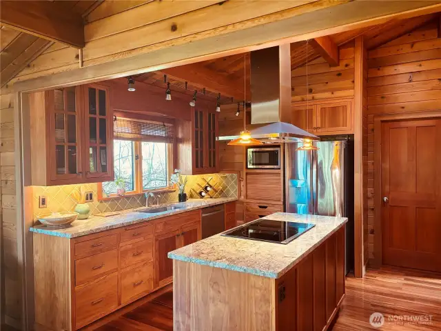 Custom built-in cabinets with lots of storage. Kitchen equipped with convection oven, dishwasher, microwave and refrigerator.