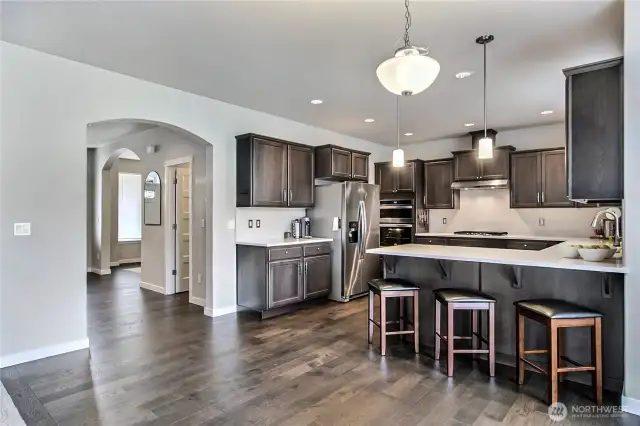 Open floorplan and living downstairs with family room adjacent to the kitchen.