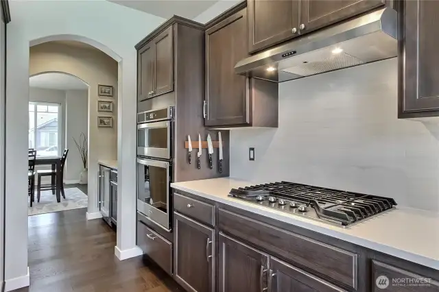 Gas range and slate cabinets with plenty of storage.