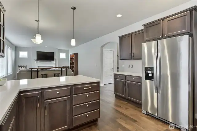 Stainless appliances and quartz countertops.