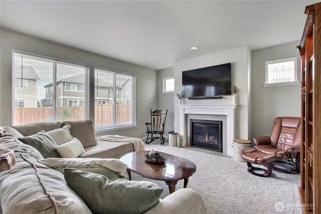 Spacious family room with gas fireplace.