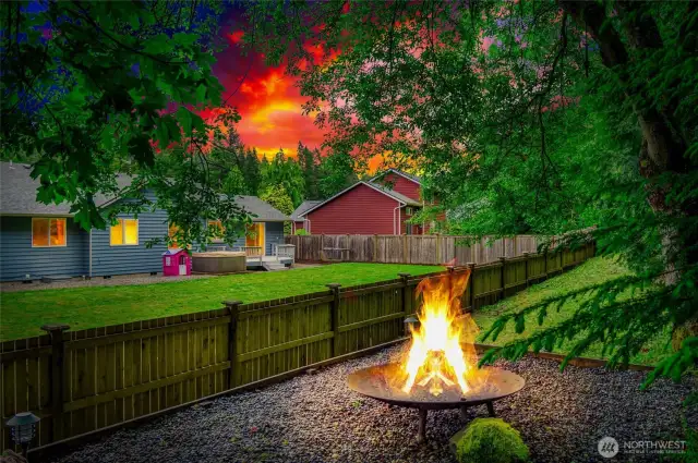 Outdoor Firepit area just beyond the fence.