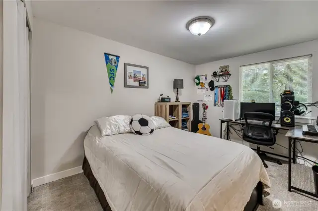 Main level bedroom with an attached 1/2 bath (1 of 3)