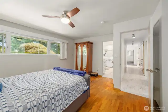 Primary bedroom on the main with hardwood floors.