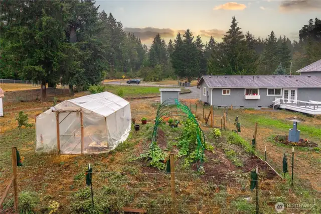 Another view of the organic garden area and greenhouse already fenced in and ready for you to grow whatever you'd like.