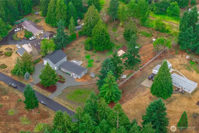 This aerial view shows the convenient circular driveway, with wide gates on both ends.