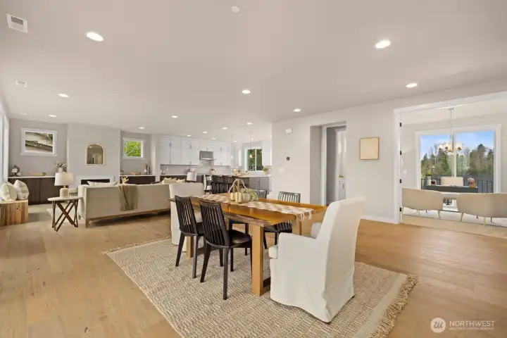 Open-concept main floor living space with gourmet kitchen and separate serving station.