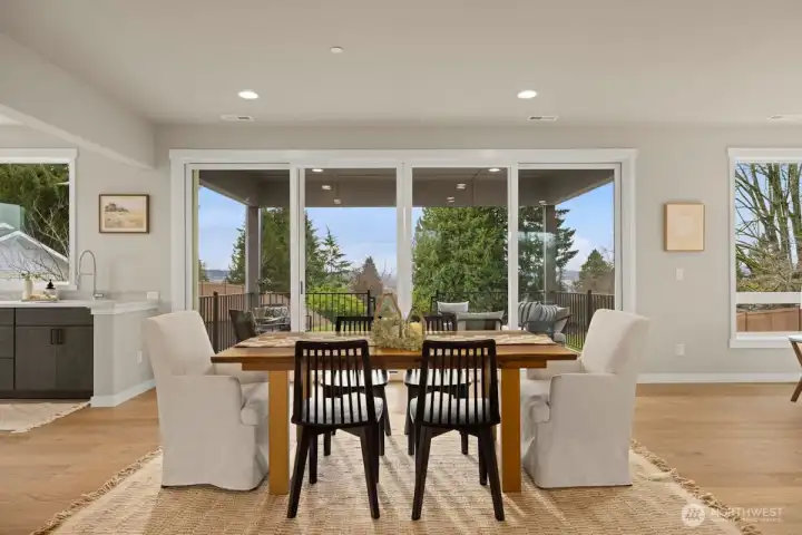 Main level dining area with access to covered deck.