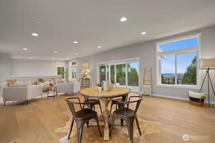 Large bonus room/studio with full kitchen, half bath and access to the partially covered deck on the rooftop level.