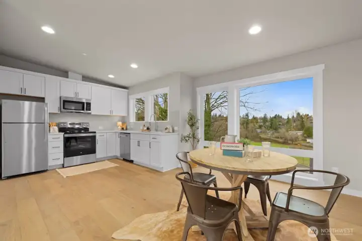 Large bonus room/studio with full kitchen, half bath and access to the partially covered deck on the rooftop level.