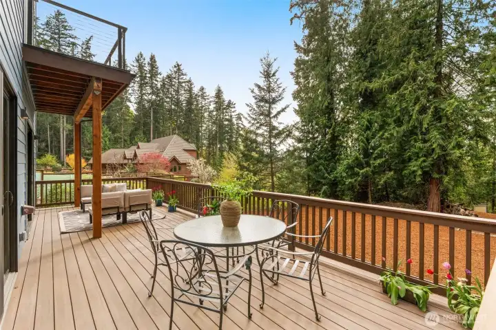 Deck off Primary also with peek-a-boo water views!