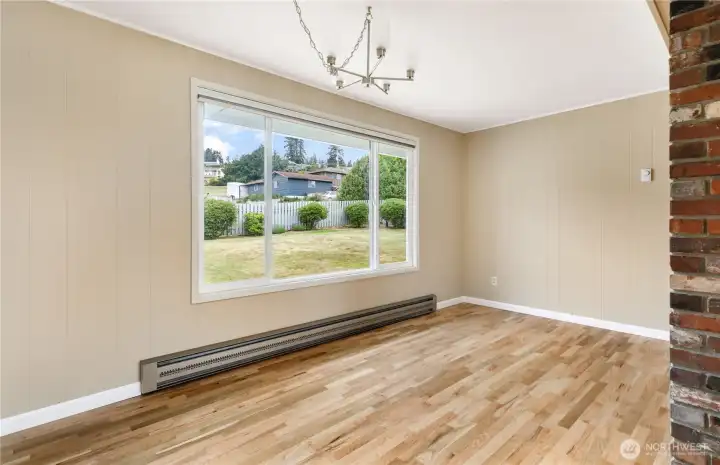 Dining room with huge window to enjoy the sunrises and hillside Dining room with huge window to enjoy the sunrises and hillside