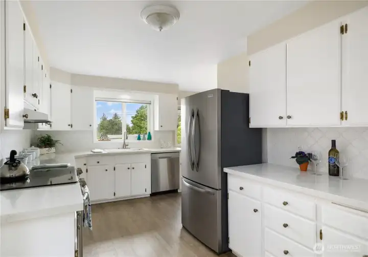 Kitchen has newer appliances, new countertops and backsplash. Bright and roomy Kitchen has newer appliances, new countertops and backsplash. Bright and roomy