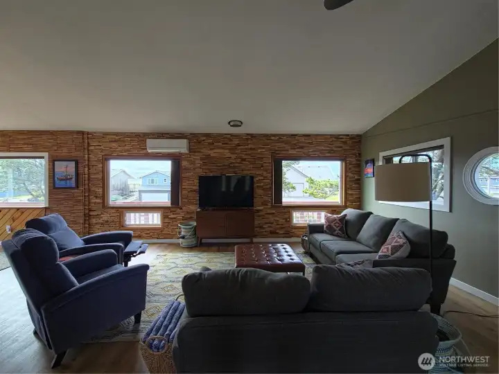 Peek-a-boo ocean views and a custom wood walls make for a very inviting space.