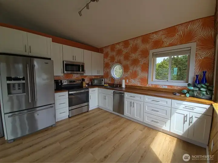 New appliances, cabinets, countertops and floors.