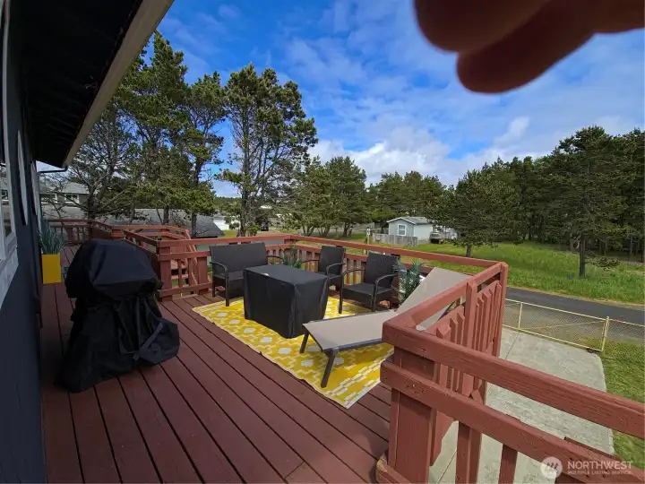 Wraparound porch with room to chill and grill