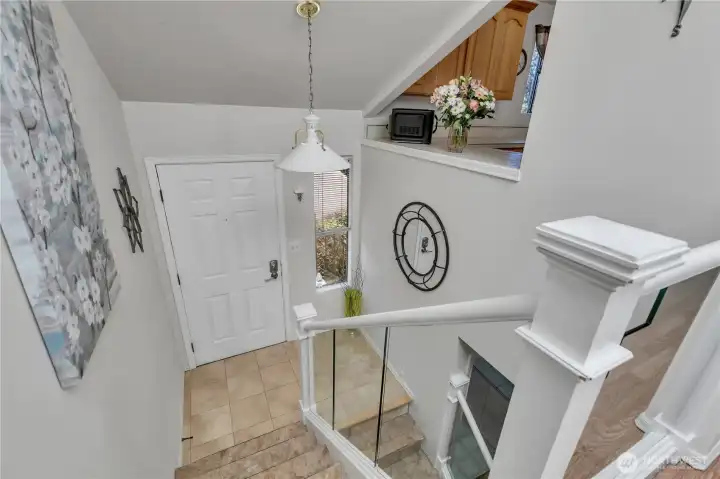 Split-level condo entryway and staircase.