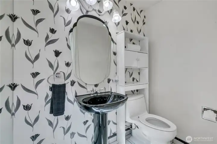 Stylish powder room with pedestal sink.
