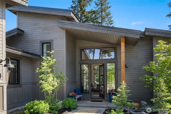 Welcoming front entry framed by refined architectural detail. Welcoming front entry framed by refined architectural detail.