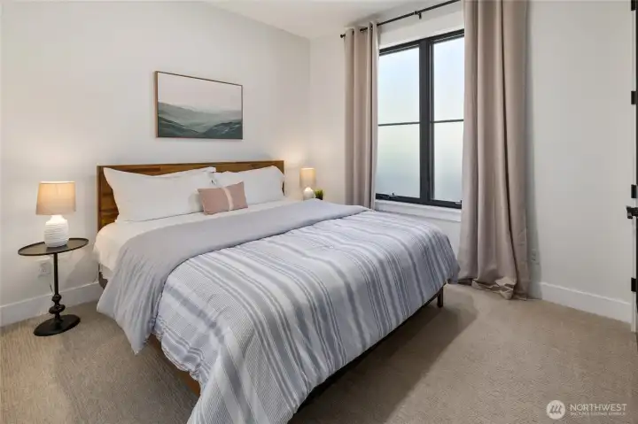 2nd main level bedroom with an adjoining bath. 2nd main level bedroom with an adjoining bath.