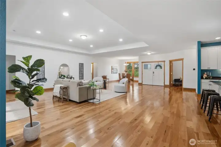 Kitchen flows to living and dining areas in this open concept floorplan