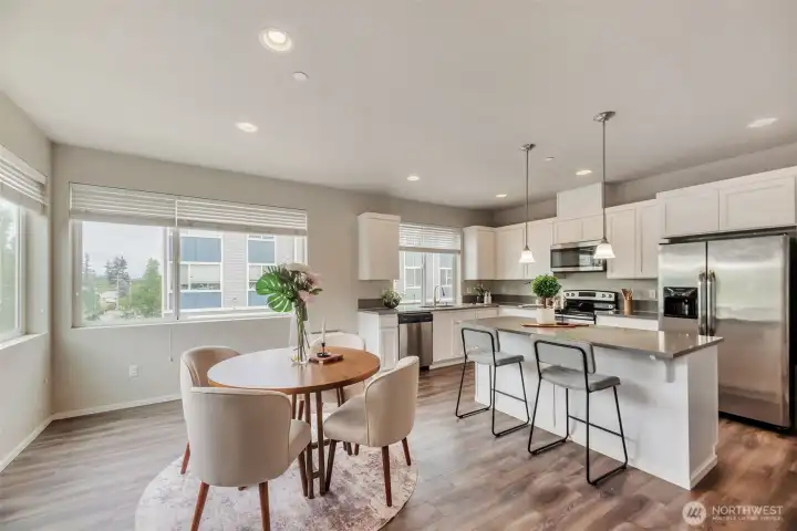 Light filled dining area adjacent to open Kitchen