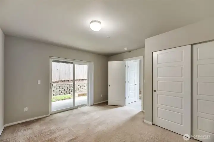 Main floor bedroom 4 w patio