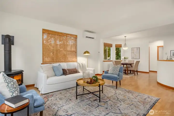 The spacious living and dining area is both bright and inviting.  This home also features a new mini-split heating and cooling system to provide all year comfort.